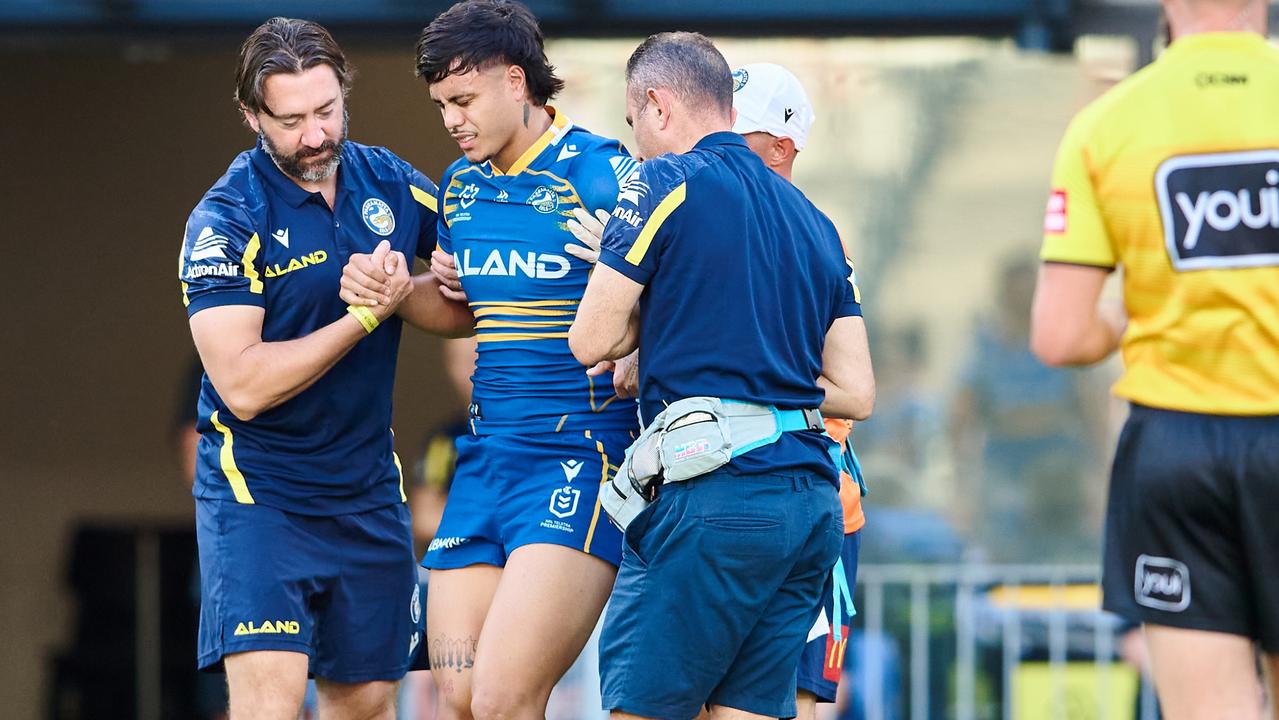 Haze Dunster is helped from the field after Tyrell Fuimaono’s tackle. Picture: Brett Hemmings/Getty Images