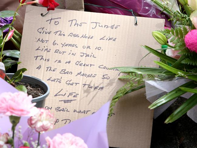 Flowers at the scene of the accident that killed Matthew Field and Kate Leadbetter. Picture: Steve Pohlner