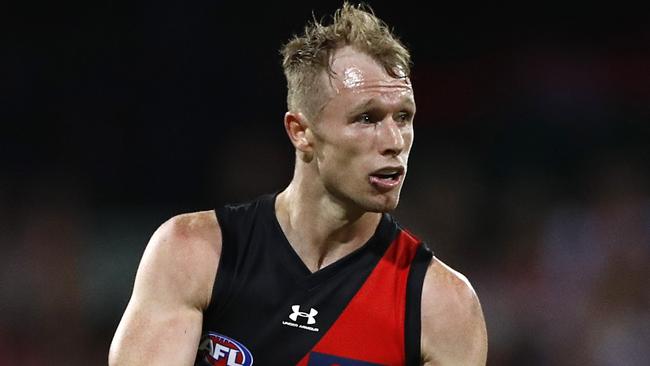 SYDNEY, AUSTRALIA - APRIL 08: Nick Hind of the Bombers looks upfield during the round four AFL match between the Sydney Swans and the Essendon Bombers at Sydney Cricket Ground on April 08, 2021 in Sydney, Australia. (Photo by Ryan Pierse/AFL Photos/via Getty Images)