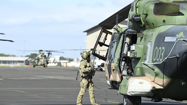 TOWNSVILLE, AUSTRALIA - JULY 27:  An Australian helicopter crewman is seen standing by an MRH 90 at the Townsville airport as part of exercise 'Talisman Sabre 23' on July 27, 2023 in Townsville, Australia. The exercises were part of the broader Talisman Sabre group exercises involving Australia, The U.S., and its Asian partners. The training will include a series of combined arms activities integrating different teams, capabilities and technologies. (Photo by Ian Hitchcock/Getty Images)