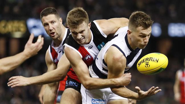 Dougal Howard attempts to wrap up Shaun Higgins. Picture: Dylan Burns/AFL Photos