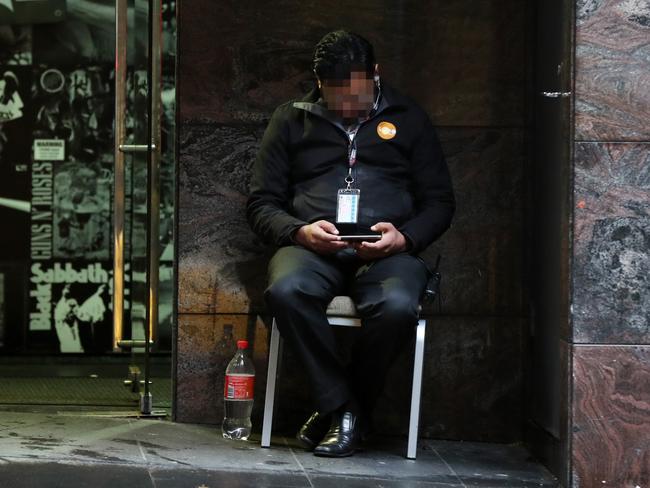 A Unified Security guard outside quarantine hotel Adina Town Hall in 2020. Picture: Jonathan Ng