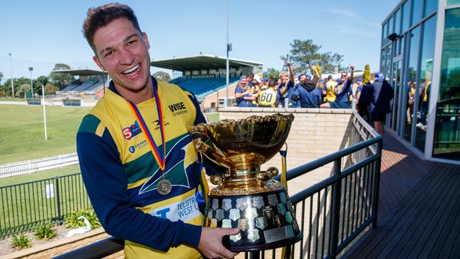 Sam Lowson with the SANFL premiership cup. Picture Matt Turner