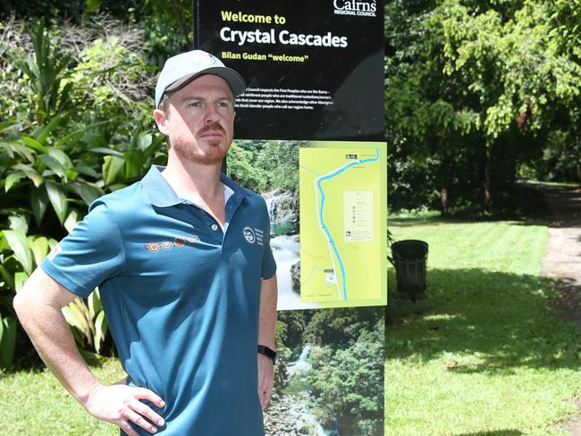 Queensland Parks and Wildlife Service regional director Matthew Brien stands by visitor information signage at Crystal Cascades. Picture: Arun Singh Mann