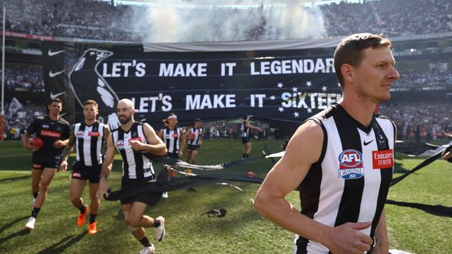 The Magpies head out onto the MCG. Picture: Robert Cianflone/AFL Photos/via Getty Images