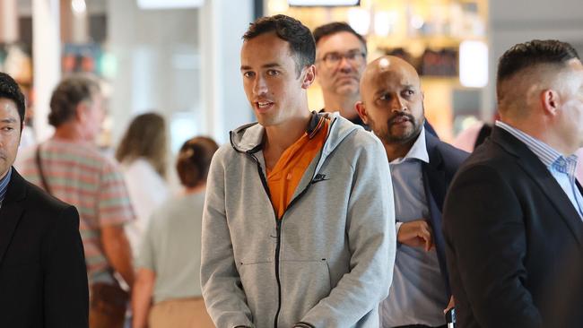 Michael Pryde being extradited from Brisbane by NSW Police. Pryde’s sports betting ponzi-style scheme defrauded victims out of approximately $4 million. Picture Tertius Pickard