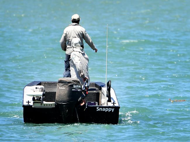 Wildlife Management patrolling the Strand after reports of a crocodile sighting. Picture: Alix Sweeney