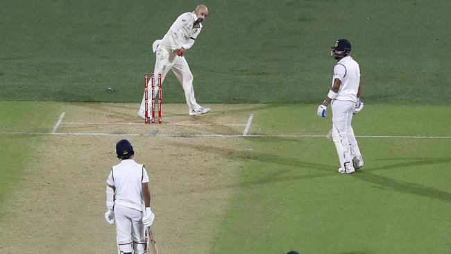 Virat Kohli is left stranded by Ajinkya Rahane as Nathan Lyon whips off the bails Picture: Getty Images