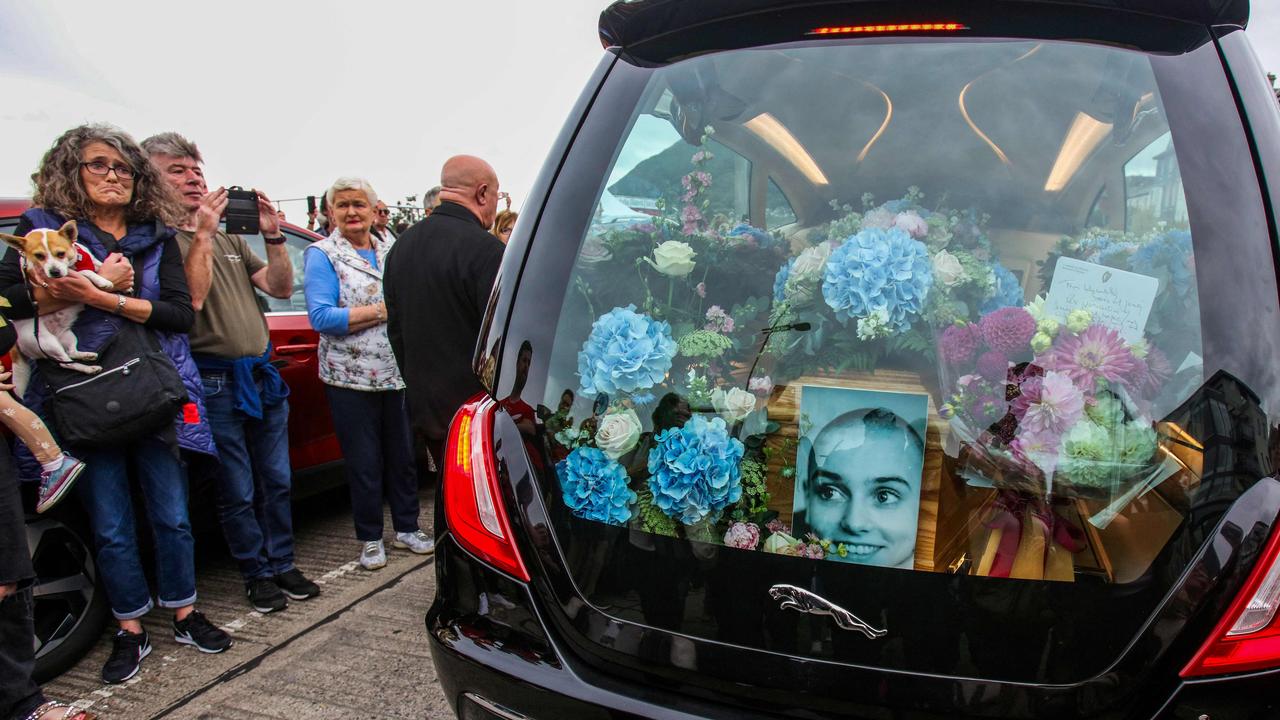 Tthe coffin of Irish singer Sinead O'Connor, in the hearse during her funeral procession outside her former home in Bray. Picture: AFP