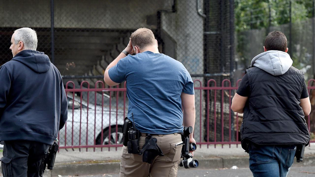 Undercover police with binoculars near Lennox Street where a safe injecting room sits right next to a primary school. Picture: Nicole Garmston