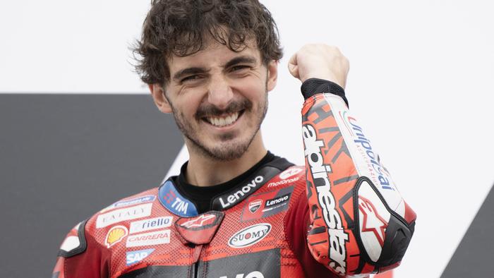 HOHENSTEIN-ERNSTTHAL, GERMANY - JULY 07: Francesco Bagnaia of Italy and Ducati Lenovo Team celebrates the victory on the podium at the end of the MotoGP race during the MotoGP Of Germany - Race at Sachsenring Circuit on July 07, 2024 in Hohenstein-Ernstthal, Germany. (Photo by Mirco Lazzari gp/Getty Images)