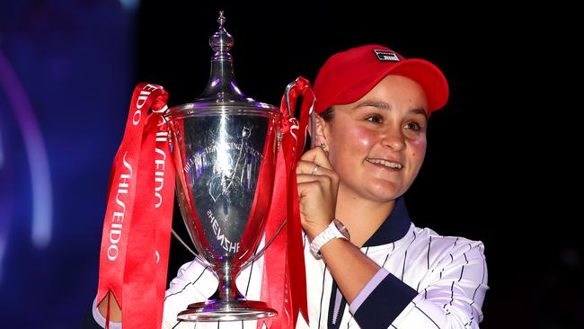 Ashleigh Barty celebrates with the Billie Jean King trophy. Picture: Clive Brunskill/Getty Images