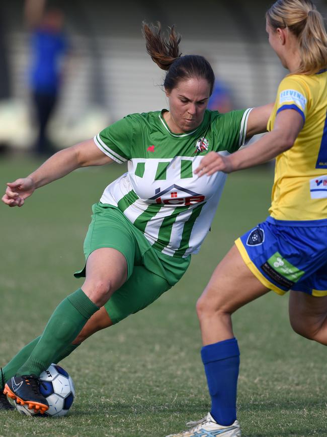 Brisbane Women's Premier League football Round 1 action between Southport and Broadbeach United at Ashmore Village Park. Broadbeach's Maya Christopher and Southport's Jane Laker. Picture: Steve Holland