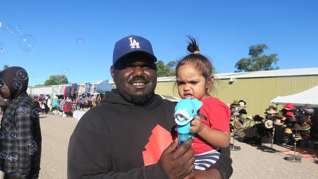 Hayden Reiff and Jetta Reiff blow bubbles as the first day of the 2023 Alice Springs Show wraps up. Photo: Laura Hooper.