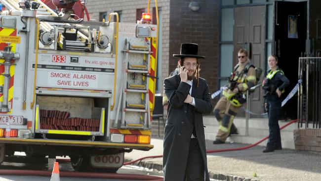 Police and fire crews mop up after a fire at a synagogue at East St Kilda. The Adass Israel Synagogue, an ultra orthodox synagogue in Ripponlea, was attacked about 4am on Friday December 6, Picture: NewsWire / Andrew Henshaw