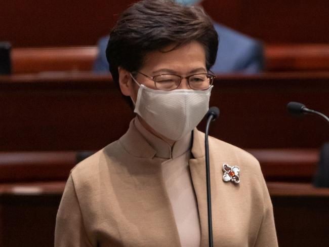 HONG KONG, CHINA - JANUARY 03: Hong Kong Chief Executive Carrie Lam attends an oath-swearing ceremony in the Legislative Council main chamber  on January 3, 2022 in Hong Kong, China. Hong Kong's Legislative Council is welcoming new members at a ceremony today, following a revamp of the electoral system by Beijing to ensure only Ã¢â¬ÅpatriotsÃ¢â¬Â hold political power. (Photo by Anthony Kwan/Getty Images)