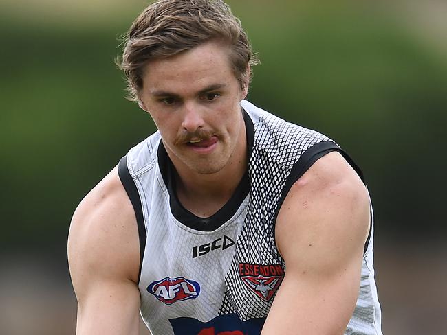 MELBOURNE, AUSTRALIA - FEBRUARY 19: Joe Daniher of the Bombers handballs during an Essendon Bombers AFL training session at The Hangar on February 19, 2019 in Melbourne, Australia. (Photo by Quinn Rooney/Getty Images)