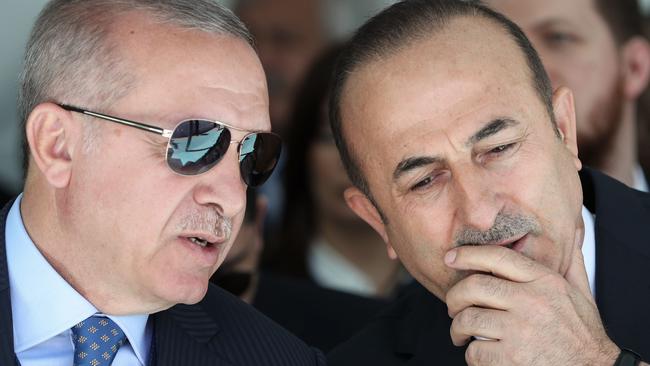 Turkish President Recep Tayyip Erdogan (L) and Turkish Foreign Minister Mevlut Cavusoglu. Picture: AP 