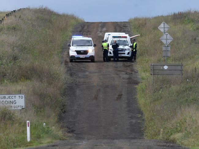 FLOOD TRAGEDY: Police officers cordon off Brimblecombe Rd in Kingsthorpe, near where a man and multiple dogs were killed in floodwaters early on Monday morning.