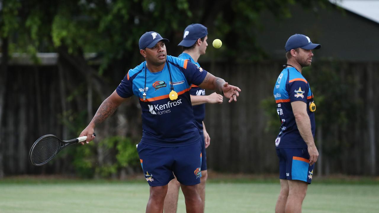 Northern Pride head coach Ty Williams his a tennis ball into the air during a drill at pre-season training at West Barlow Park. Picture: Brendan Radke