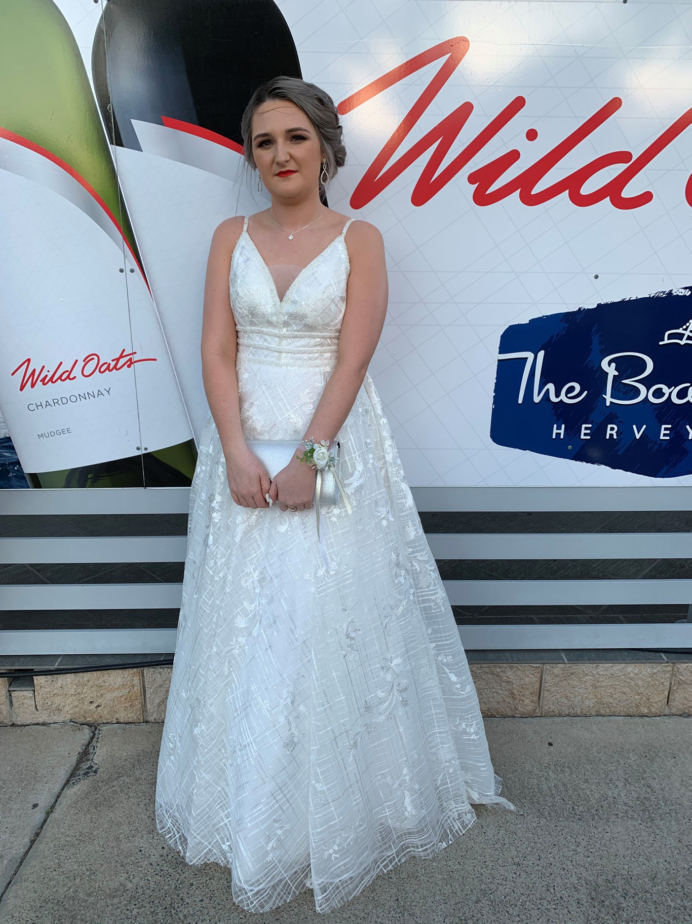 Kaitlyn Maxwell looking stunning in her white dress at the Fraser Coast Anglican College formal.