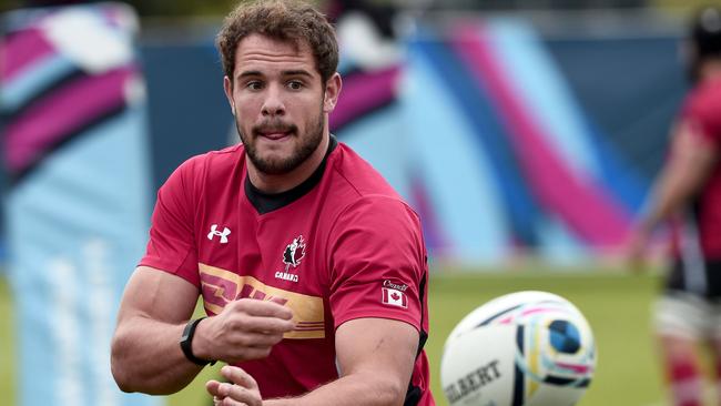 (FILES) In this file photo taken on September 15, 2015, Canada's centre Tyler Ardron takes part in a training session at Swansea university, ahead of the 2015 Rugby Union World Cup. - Ardron will compete with Canada in pool B of the 2019 Rugby World Cup in Japan, scheduled from September 20 to November 2, 2019. (Photo by Damien MEYER / AFP)