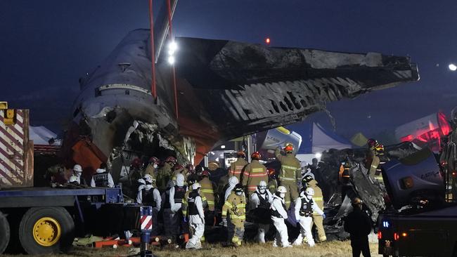 Rescue teams at the scene of the plane crash at Muan International Airport. Picture: AP