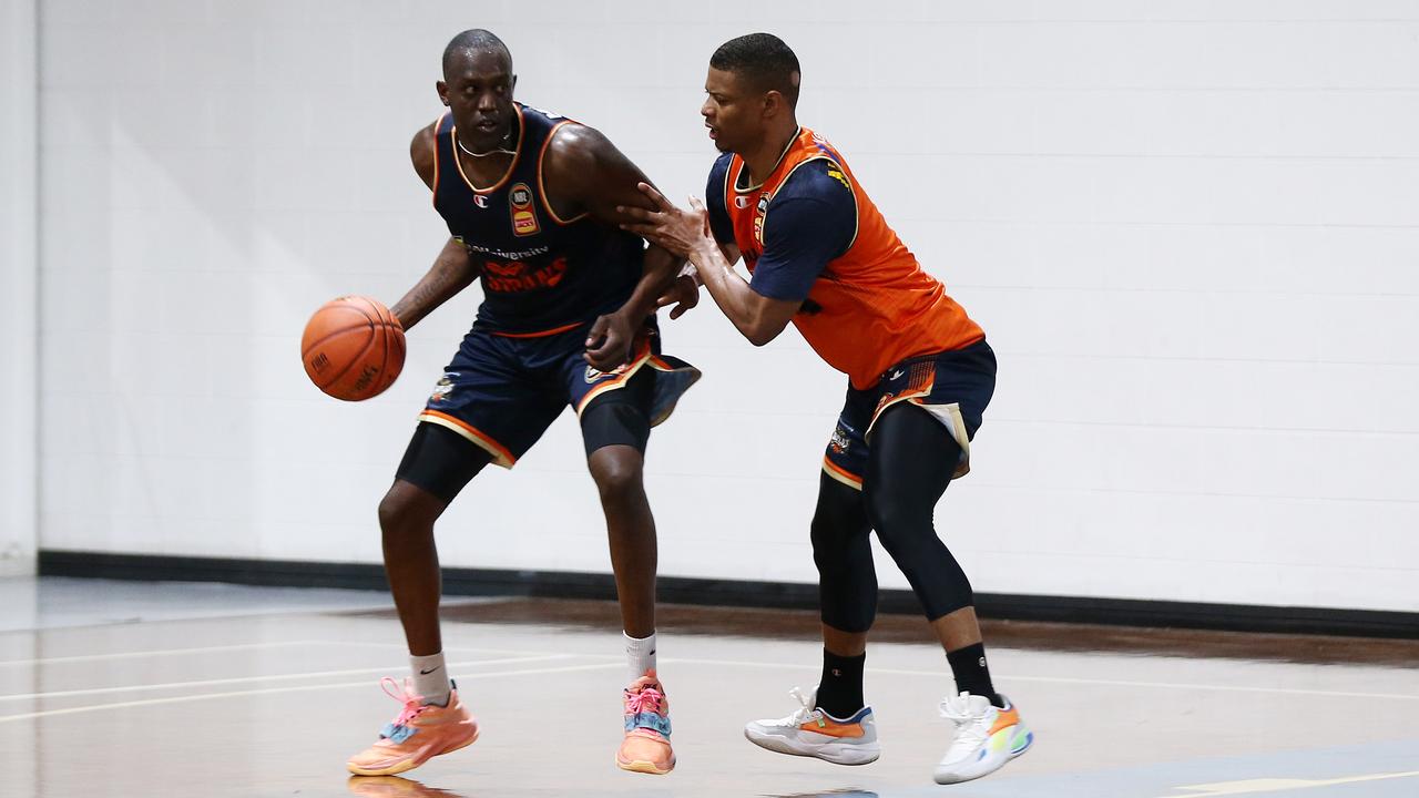 Kouat Noi goes up against Scott Machado at Taipans pre-season training at Cairns Basketball Centre, Manunda. PICTURE: Brendan Radke