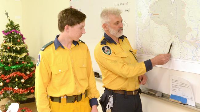 Grose Vale RFS deputy captain Troy Slender and son Jackson, 14, are preparing to protect the 1200 properties at Bowen Mountain village today, including their own. Photo: Jeremy Piper