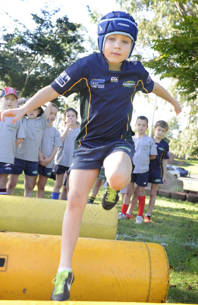 GPS junior Riley Canavan, aged seven, learning the fundamentals of rugby at Marist Ashgrove. Photo By Patria Jannides