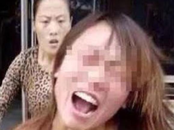 CREDIT: AUSTRALSCOPE ONLINE USE ONLY A woman accused of sleeping with another woman's husband was stripped naked and beaten senseless in broad daylight in China as passers-by watched on. It is only the latest in a number of similar incidents in which it seems there is placid acceptance in Chinese society of such humiliation, as long as the victim is seen as deserving in having caused a man to cheat on his partner. On this occasion, accused Lin Yao Li, 38, was ambushed by four women as she walked home from the shops in the city of Puyang in eastern China’s Henan Province.
