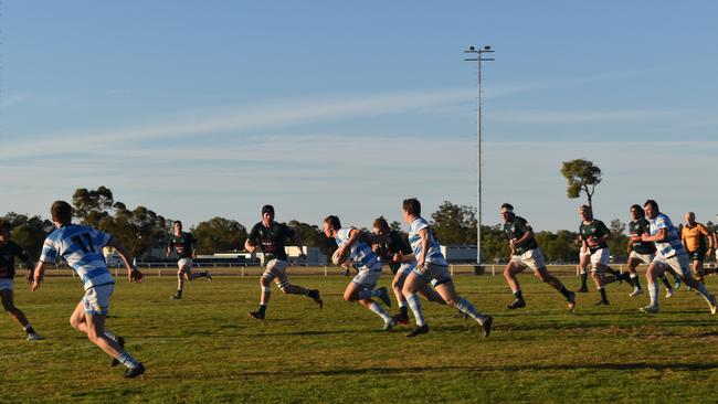 Spectators cheer on as they watch the A Grade Roma vs Condamine match at the Roma Rugby Races at Bassett Park. Picture: Chloe Cufflin.