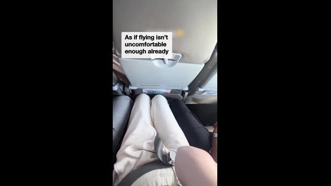 Man invades woman's legroom on flight