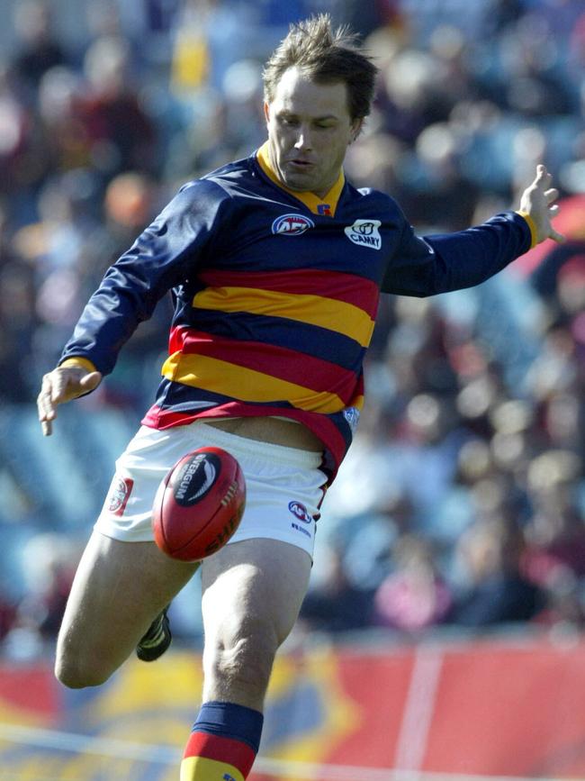 Modra kicks for a goal as part of a promotional event in 2005.