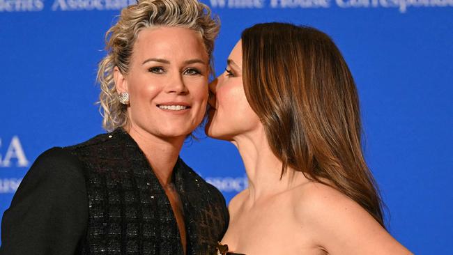 US former football player Ashlyn Harris (L) and US actress Sophia Bush arrive for the White House Correspondents' Association (WHCA) dinner at the Washington Hilton, in Washington, DC, on April 27, 2024. (Photo by Drew ANGERER / AFP)