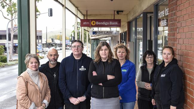 Local traders outside the soon-to-close Bendigo Bank branch at Korumburra (from left), Jennie Keerie, Milpara Community House; Rick Arestia, Burra Barber; Phil Dempster, Burra Brewery; Shirley Arestia, Korumburra Business Association secretary; Kelly Hughes, Burra Garden Supplies; Kerry Martin, Burra Newsagency; and Maria Condalucci, Kelly’s Bakery.