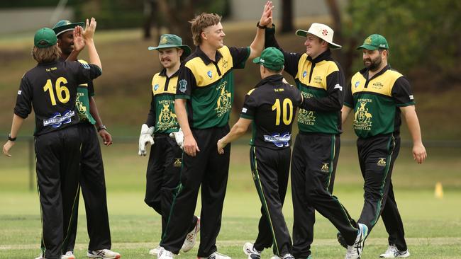 VSDCA Bayswater players celebrate a wicket. Picture: Stuart Milligan