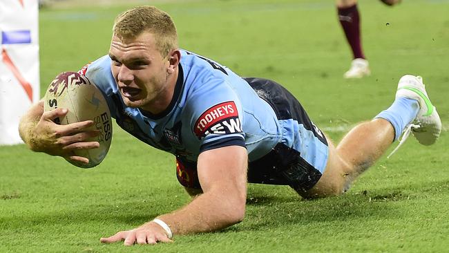 Tom Trbojevic scores one of his three tries. Picture: Ian Hitchcock/Getty Images