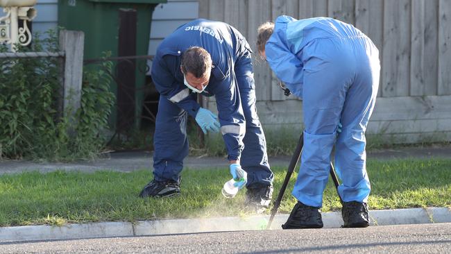 Forensic police at the scene. Picture: David Crosling