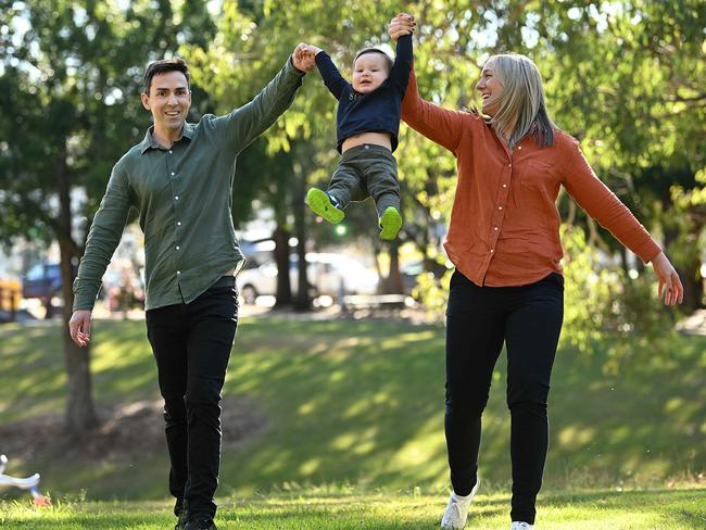 Angus Cave with 16 month old son Noah and mum Rebecca Schulz, at a park near their home in Mount Gravatt, Brisbane. pic Lyndon Mechielsen