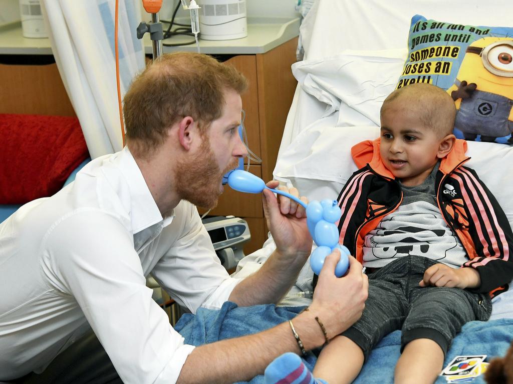 Prince Harry chats with a patient as he visits Oxford Children's Hospital. Picture: AP 