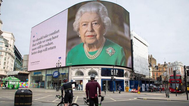 An image of Queen Elizabeth II in London with quotes from her recent broadcast about the coronavirus pandemic. Picture: Dominic Lipnski/Zuma Press