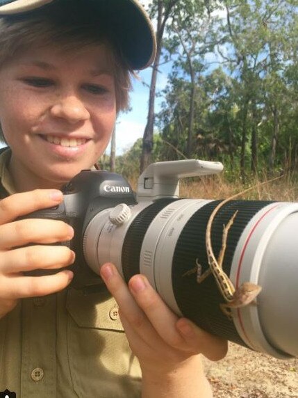 Here's a photo of Robert on the Steve Irwin Wildlife Reserve with this little guy on his camera. Can you find the two lined dragon on his camera? Picture: Australia Zoo/Instagram