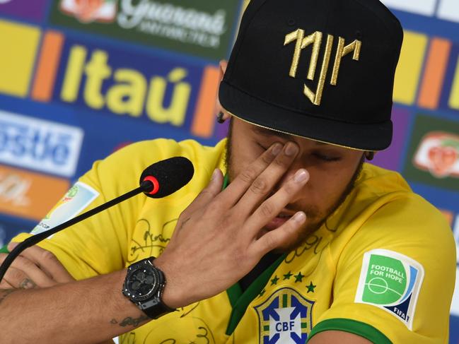 Brazil's forward Neymar gestures during a press conference in Teresopolis on July 10, 2014, during the FIFA World Cup. Brazil will face Netherlands on July 12, in the third place play-off for the FIFA World Cup tournament at The Mané Garrincha National Stadium in Brasilia. AFP PHOTO / VANDERLEI ALMEIDA