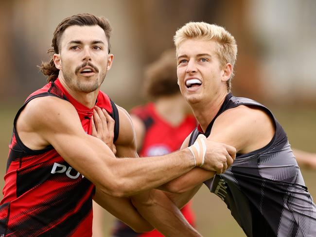 MELBOURNE, AUSTRALIA - JANUARY 16: Sam Draper of the Bombers and teammate Nick Bryan in action during the Essendon Bombers AFL training session at The Hangar on January 16, 2025 in Melbourne, Australia. (Photo by Michael Willson/AFL Photos via Getty Images)