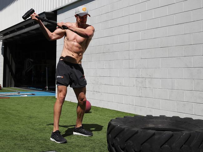 Deledio does a workout with the tyre. Picture: Phil Hillyard