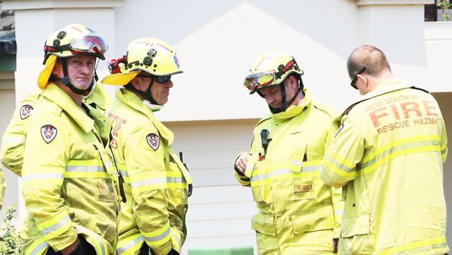 Wollongong firefighter Rod Watts, left, at Tallwood Estate fire south of Taree. Picture: Peter Lorimer