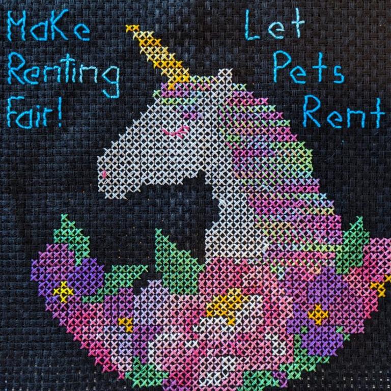 Stitch & Resist – Make Renting Fair! Let Pets Rent, stitched by Britt.