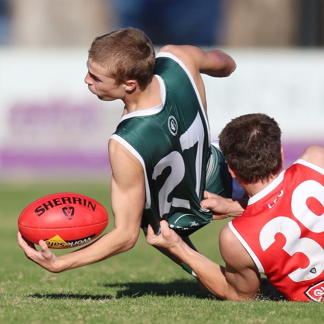 Shepparton Swans’ Luke Davies tackles Echuca’s Kade Anderson.