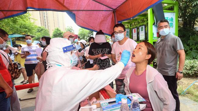 A resident is given a test for the coronavirus in Wuhan in 2021. Picture: AFP